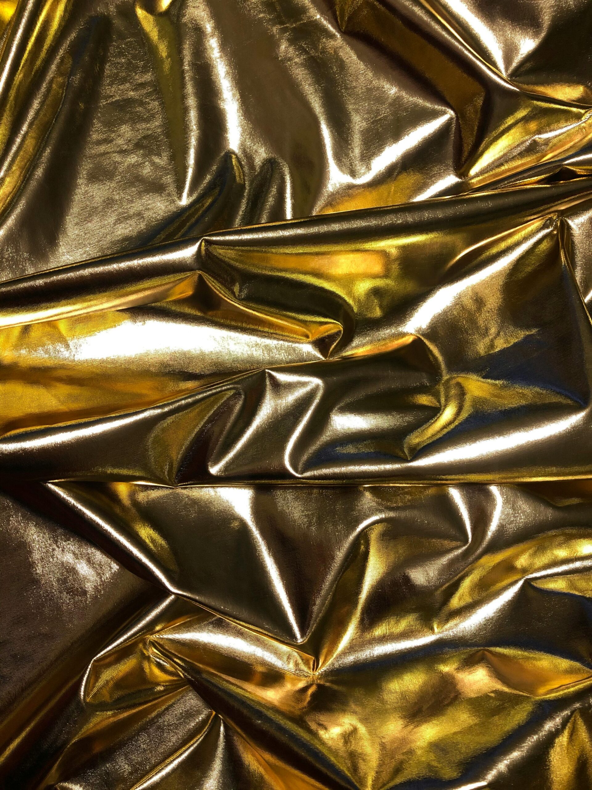 pexels-photo-3467946-3467946 Crinkled gold metallic texture creating a luxurious and vibrant background.